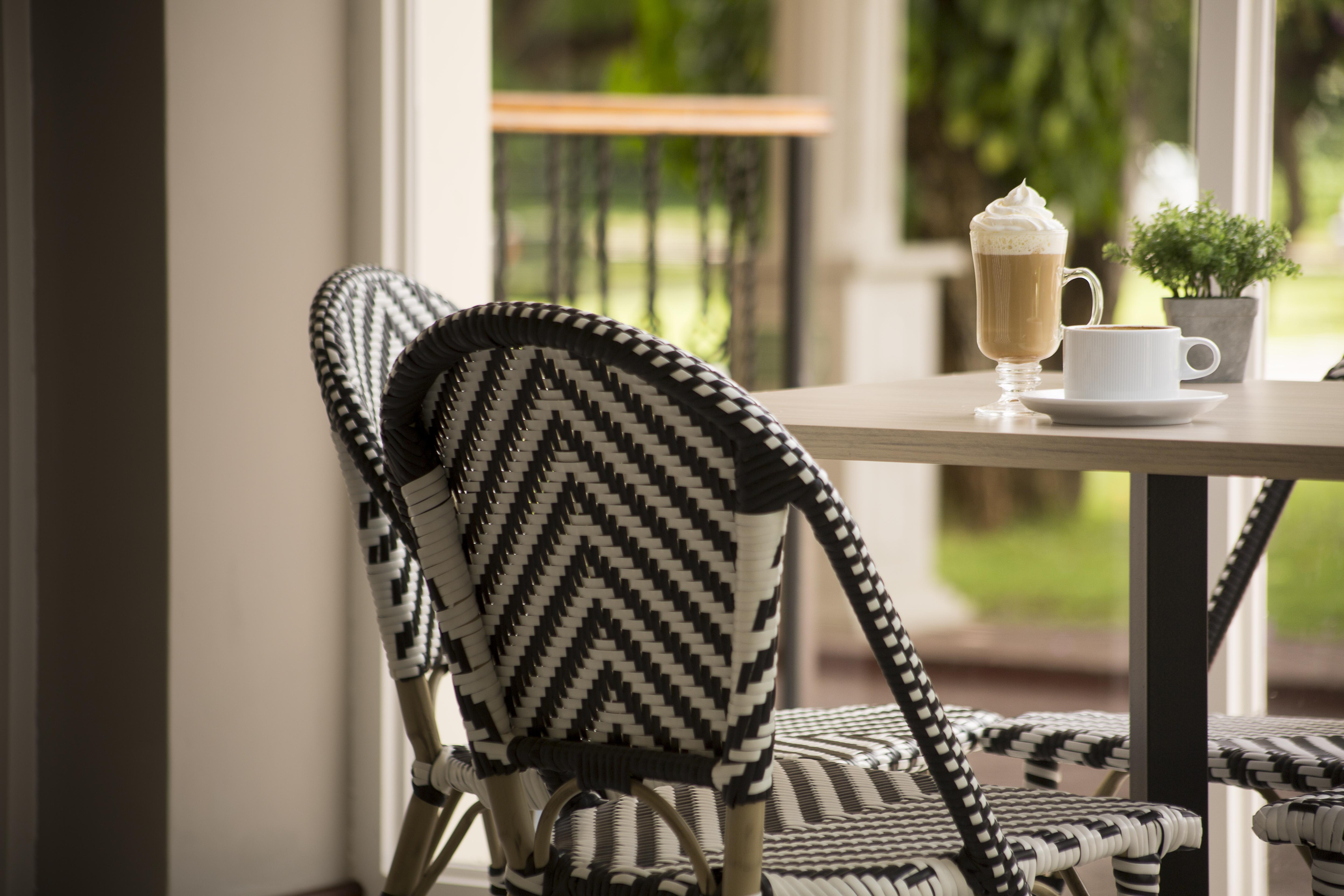 Radisson Hotel Panama Canal Exterior photo A typical bistro chair