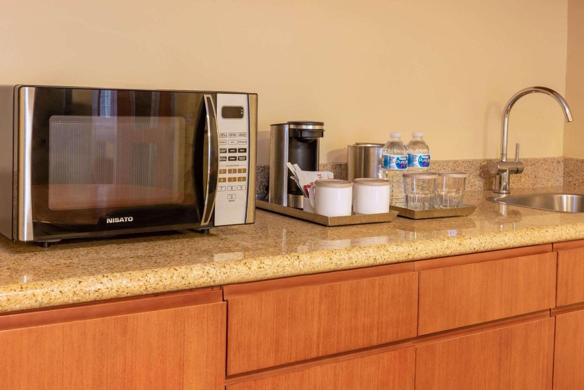 Radisson Hotel Panama Canal Exterior photo A coffeemaker in a hotel room